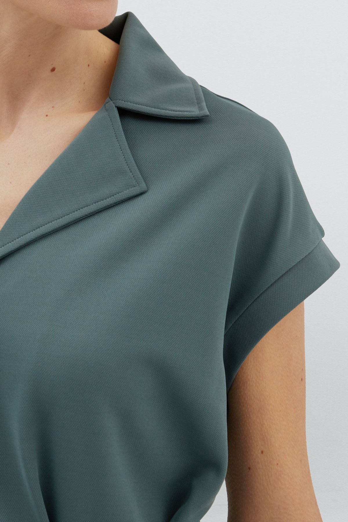Green women's short jumpsuit